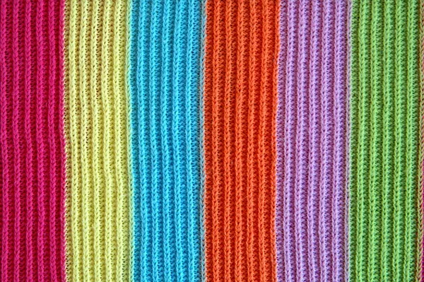 multicolored woolen soft texture striped. striped pattern fabric wool. multicolored woolen soft texture. knitted blanket from multi-colored threads. Knitted texture. Strips Backgrounds.