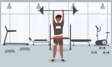 Genç ve formda bir adam spor salonunda halter kaldırıyor..