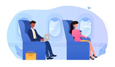 Rahat bir uçakta oturan genç bir iş adamı.