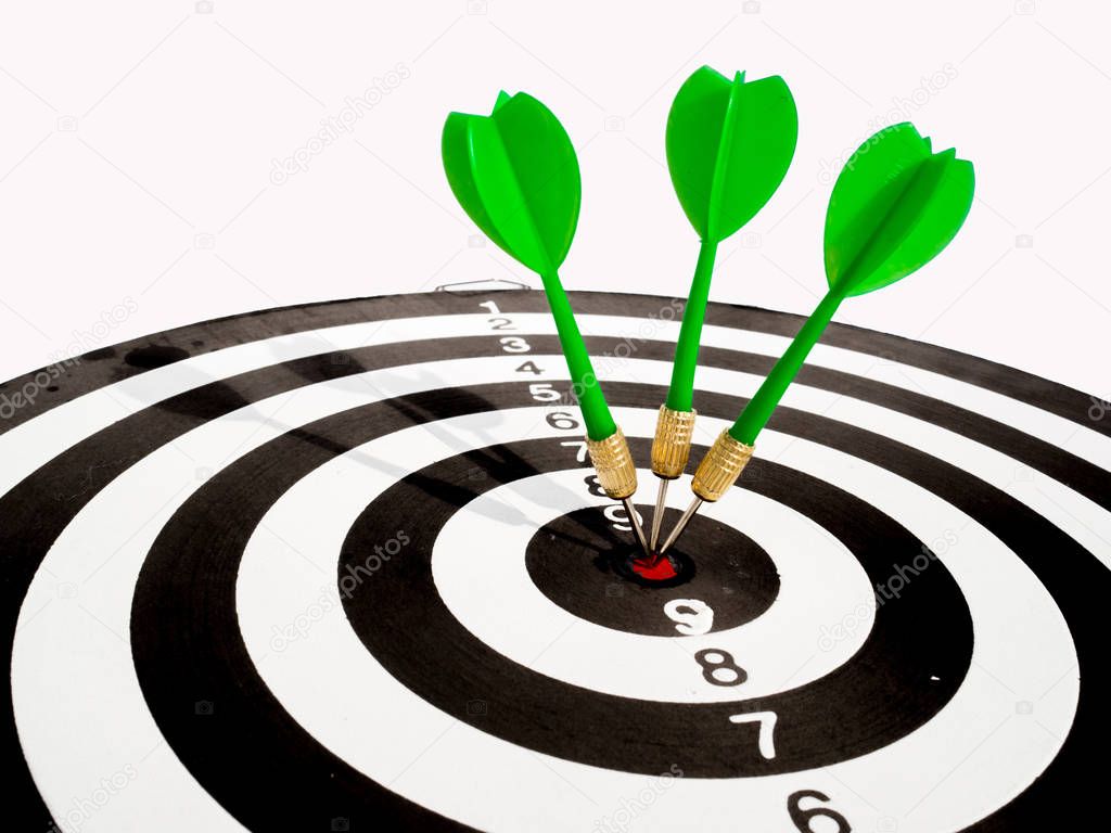 Target with three green dart focus on bull's eye, Setting challenging business goals And ready to achieve the goal with teamwork concept