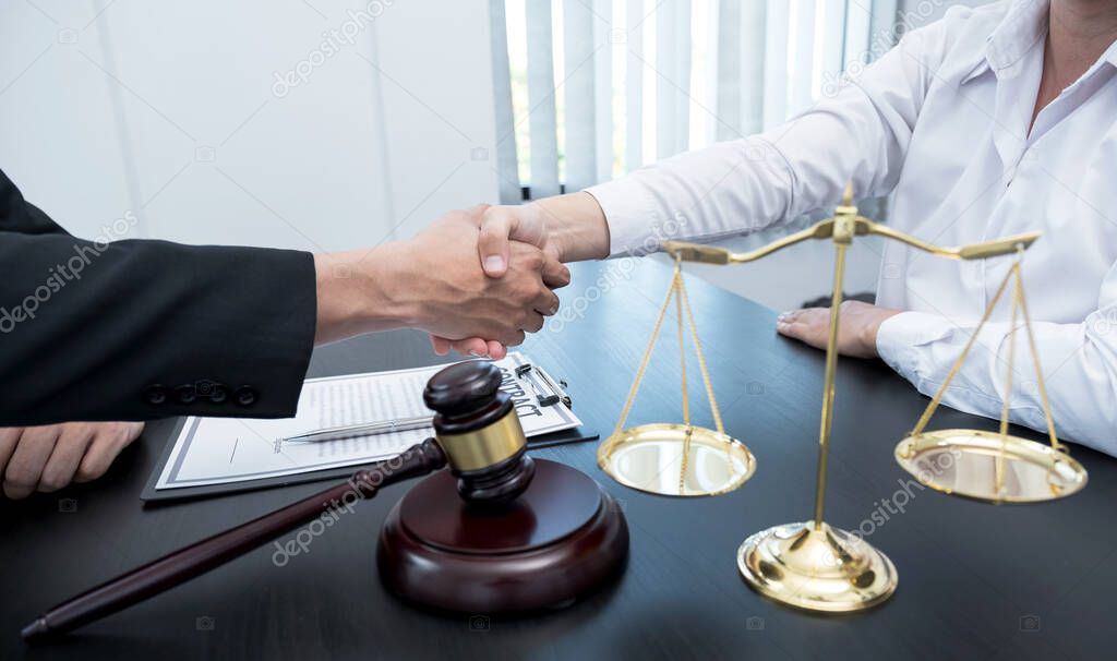 handshake after the male lawyer is providing service to consult business dispute to businessman.