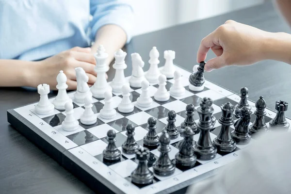 hand move chess with strategy and tactic to win enemy, play battle on board game, business opportunity  competition strategic challenge concept.