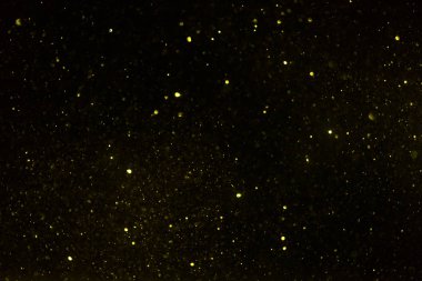 Siyah arkaplan ile soyut altın bokeh