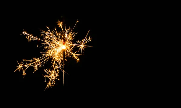 Christmas sparkler on black background. Bengal fire — Stock Photo, Image