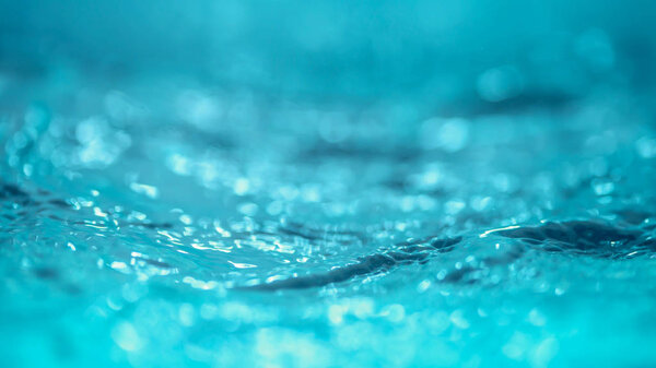 Water wave abstract background bokeh and droplets.
