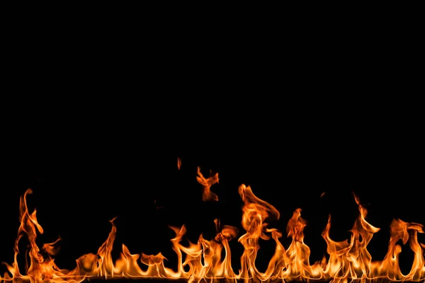 Llamas de fuego sobre fondo negro. — Foto de Stock