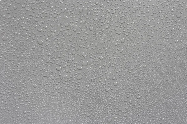 Rain on the hood, gray background car. — Stock Photo, Image