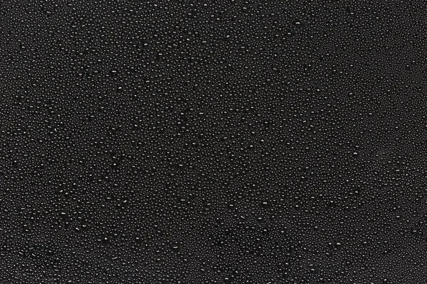 Wassertropfen auf schwarzem abstrakten Hintergrund — Stockfoto