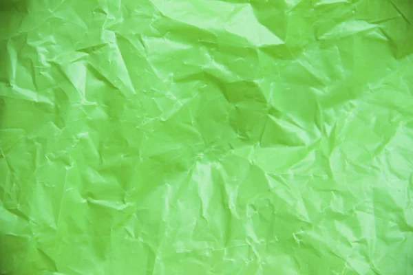Пластиковое покрытие на зеленом фоне — стоковое фото