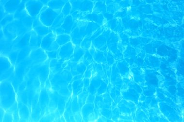 Blue color water in swimming pool rippled water detail backgroun clipart