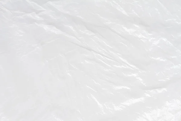 Текстура белого пластикового мешка, макро-, фон — стоковое фото