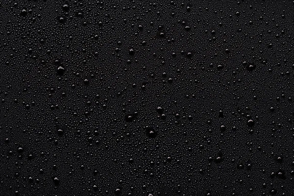 Water drops on black — Stock Photo, Image