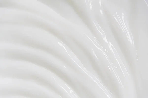 Biała powierzchnia kremu balsam zmiękcza tło. — Zdjęcie stockowe