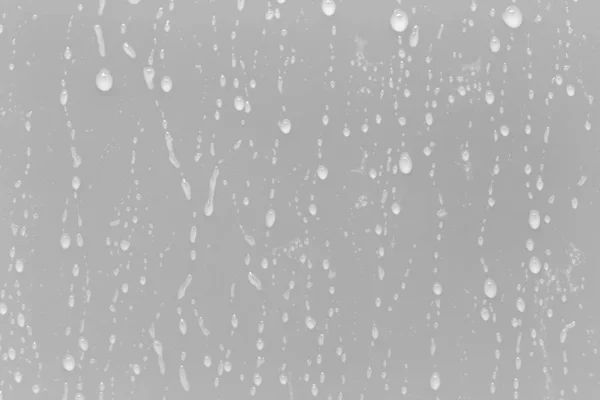 Gotas de agua sobre un fondo gris —  Fotos de Stock