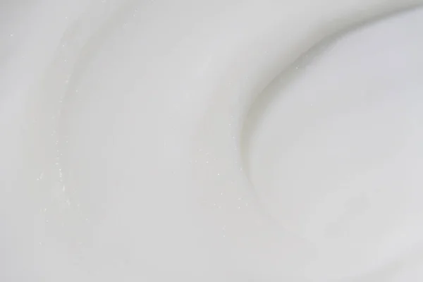 Η λευκή επιφάνεια της κρέμας κρέμα μαλακώνει το φόντο. — Φωτογραφία Αρχείου