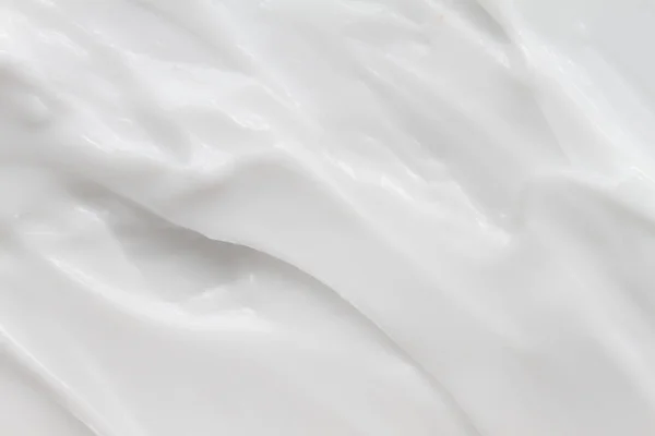 Kozmetikumok. Tejszín fehér háttér textúra. — Stock Fotó