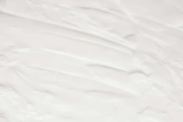 Cosmetice. Crema textura de fundal alb . — Fotografie, imagine de stoc