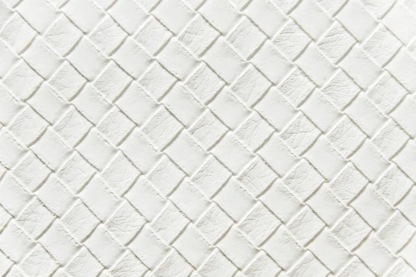 White braided leather background.