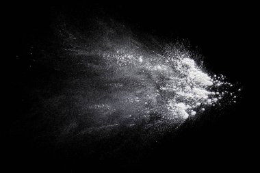 Color powder white splashes  dust on a black background. clipart