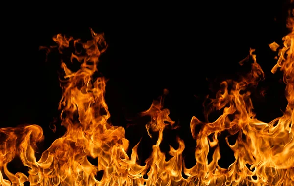 Tűz lángok fekete háttér. — Stock Fotó