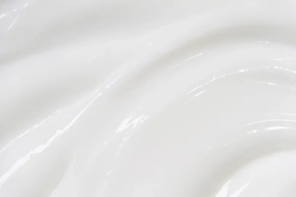 Bílý povrch krémově mléka změkčuje pozadí. — Stock fotografie