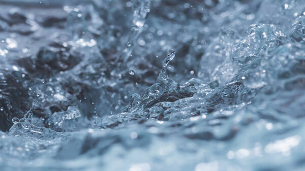 Water wave abstract background bokeh and droplets.