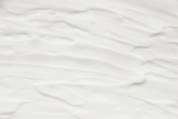 Cosmetice. Crema textura de fundal alb . — Fotografie, imagine de stoc