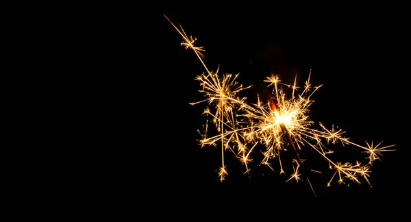 Christmas sparkler on black background. Bengal fire Stock Photo