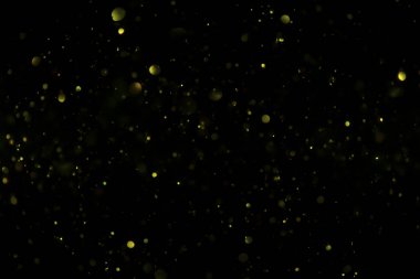 Siyah arkaplan ile soyut altın bokeh