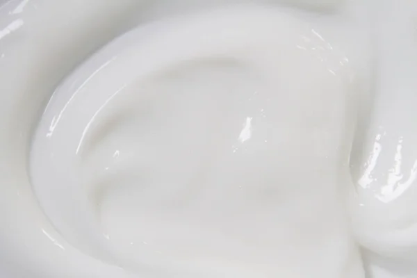 Біла поверхня кремового лосьйону пом'якшує фон . — стокове фото