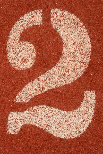 Number 2 on the rubber floor for running athletics background.