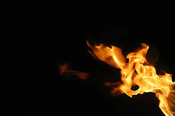 Fire flame isolated on black background — Stock Photo, Image