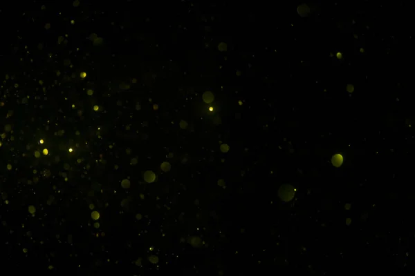 Abstract gold bokeh with black background — Stock Photo, Image