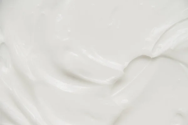 Cosmétiques. Texture de fond blanc crème. — Photo