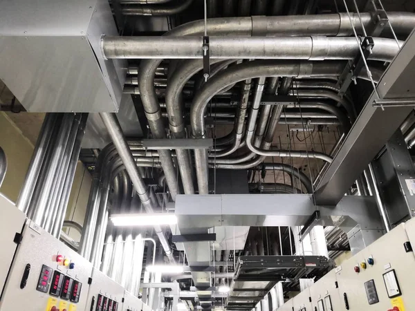 Full of galvanized steel conduits and Pull box for cable wiring joint with electrical box on cement ceiling at Main Distribution Board room.