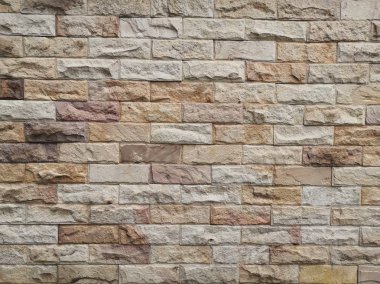 Taş arka plan duvarları yığılmış. Taş kaplama arka plan ve duvar kağıdı.tuğla duvar arka plan. Tuğla duvar dokusu arka plan.