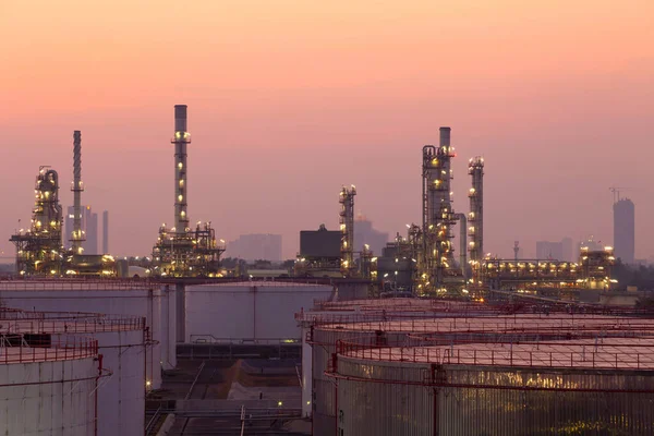 Oil refinery plant from industry, petrochemical oil and gas refinery and pipeline industry with sunset sky background
