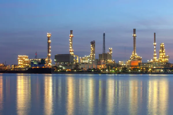 Oil refinery plant from industry, petrochemical oil and gas refinery and pipeline industry with sunrise sky background