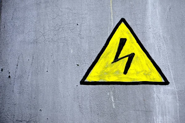 high voltage sign on the wall