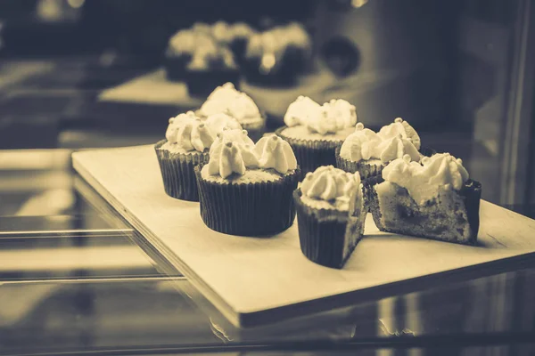 many beautiful cakes on a tray