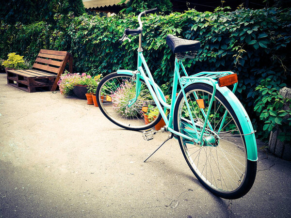 bright turquoise bicycle at the street