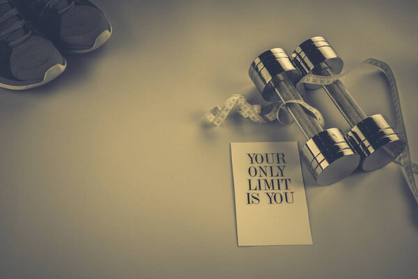 centimeter, dumbbells on a pink background