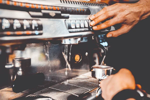 stock image barman prepares coffee in a coffee machine