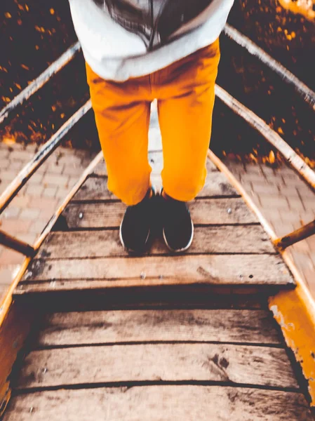 feet on a swing-boat