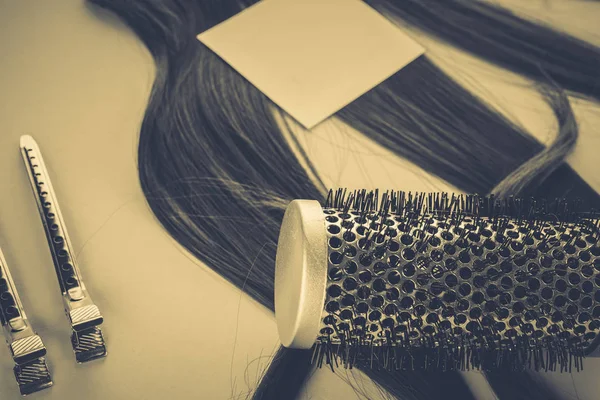 Hairdresser concept: false hair and hairpins — Stock Photo, Image