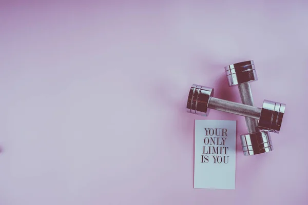 Sports concept: dumbbells on a pink background — Stock Photo, Image