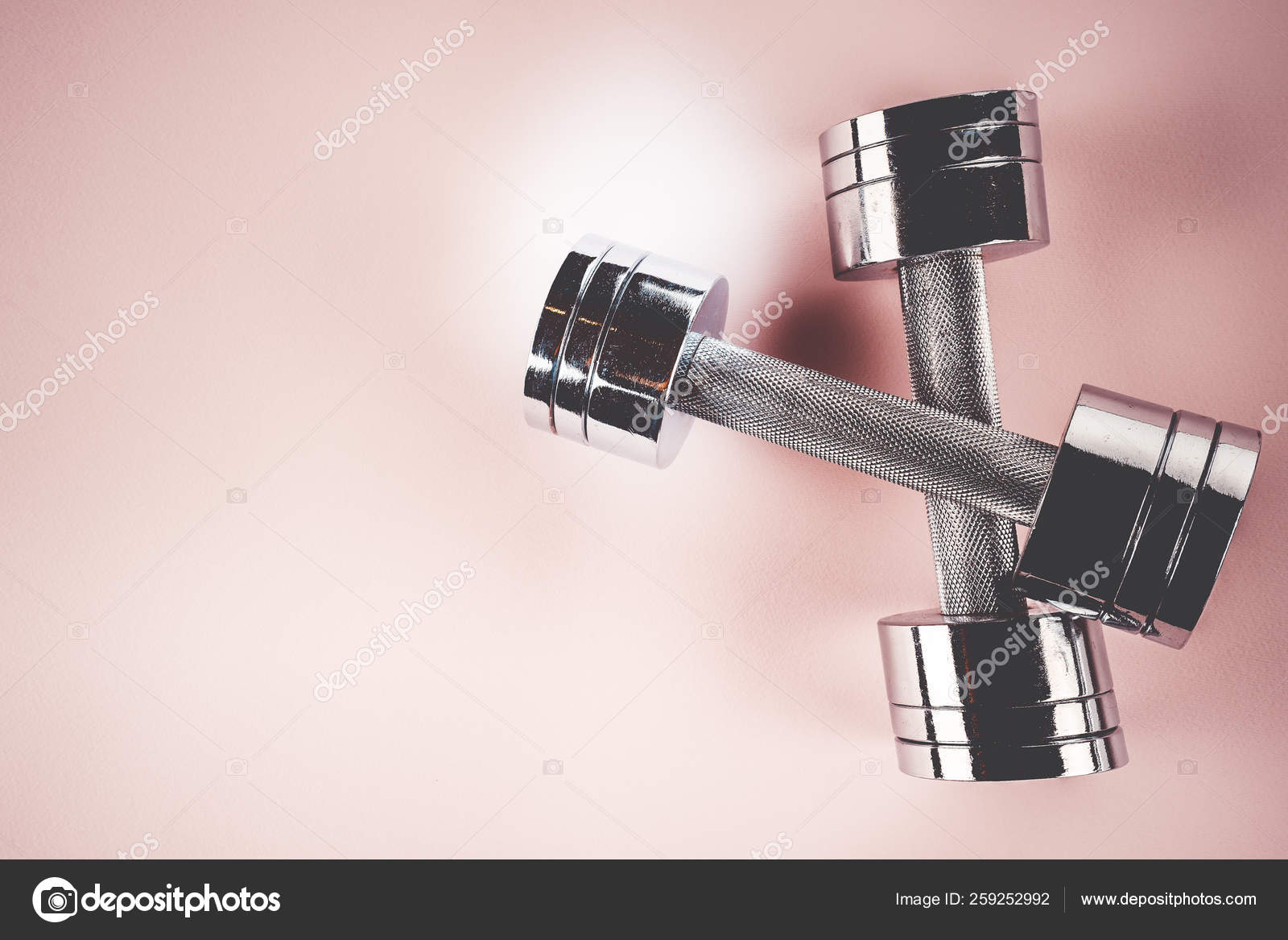 Sports concept: dumbbells on a pink background Stock Photo by ©aallm  259252992