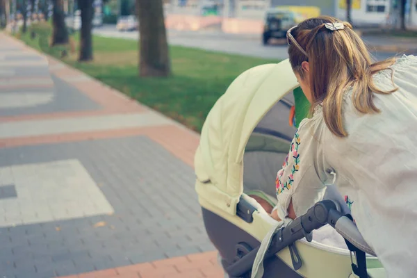Mother with a stroller — Stock Photo, Image