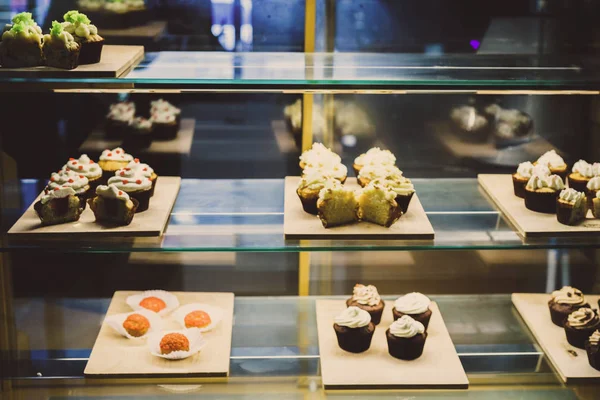 many beautiful cakes on a tray