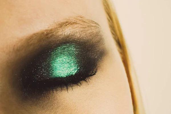 Makeup with green shadows